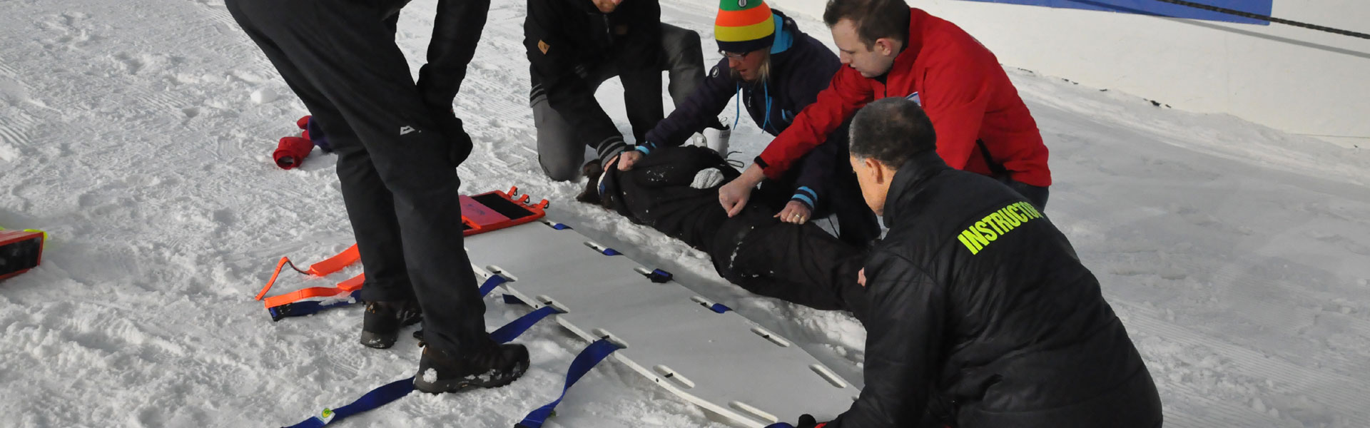 Image of casualty being put on board in snow environment